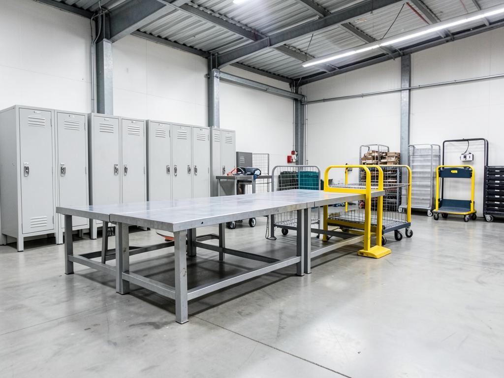 Warehouse equipment including lockers, workbenches, trolleys and safety barriers