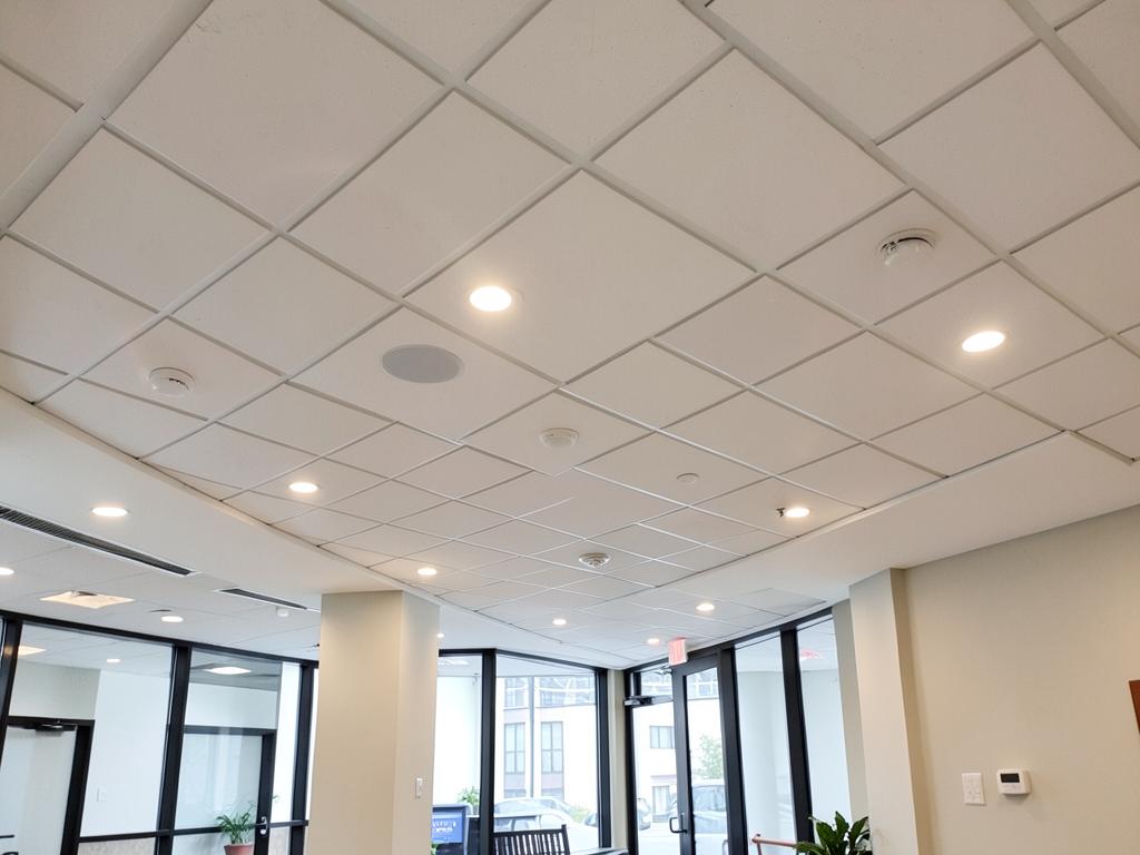 Newly installed suspended ceiling grid with recessed lighting